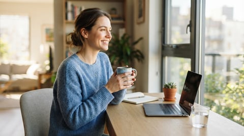 Young professional sitting comfortably in a bright home workspace